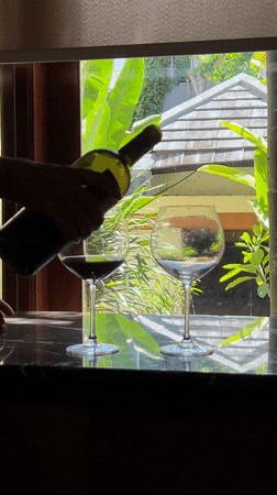 Wine poured outdoors in Kuta Selatan, Indonesia morning scene