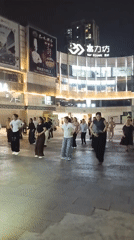 Community group performs nighttime line dancing in Chongqing square