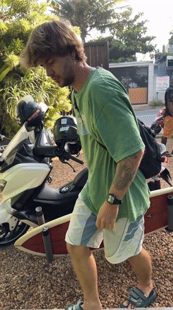 Surfboards and a scooter at a tropical Sri Lanka spot