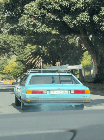 Vintage Blue Volkswagen Drives Cape Town Street Near Table Mountain