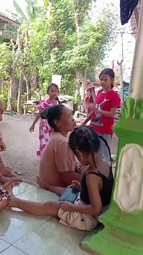 Backyard hangout in Baron: kids playing, adults relaxing