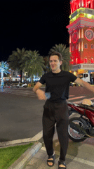 Nighttime food stalls and illuminated landmarks captured in Phú Quốc