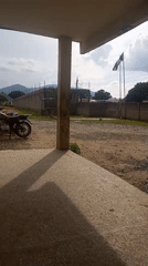 Motorcycle parked outside a Nigerian compound