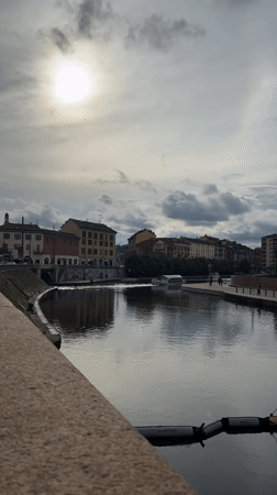 Quiet canal moment captured in Milan under cloudy skies