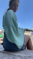 Woman plays flute outdoors in Budva Montenegro morning session
