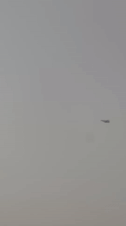 Fighter jet passes over hazy skies above Quetta