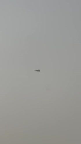 Fighter jet passes over hazy skies above Quetta