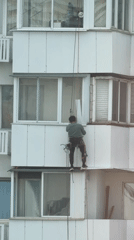 Building maintenance and dinosaur sculpture documented in Khimki