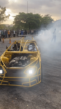 Custom drift car performs for crowd in Abuja parking lot