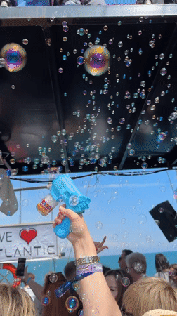 Person creates bubble display in Turkish town square