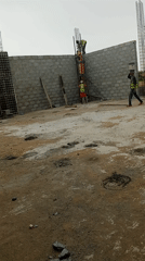 Construction workers build wall, work concrete structures April 8