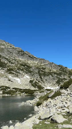 Alpine lake and snowy slopes near Samokov, Bulgaria