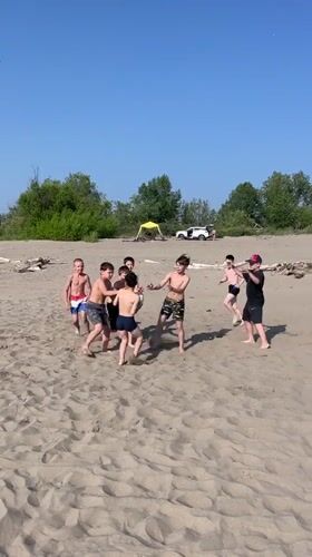 Summer beach day in Krasnoturansk: sand, ATVs, and river water