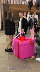 Woman with pink gift box spotted at Moscow subway station