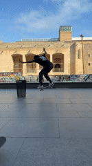 Skateboarders perform tricks in Barcelona plaza during afternoon session