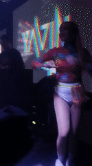 Night out at a busy club under colored strobe lights