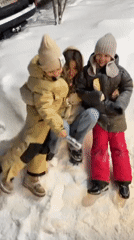 Family enjoys snowy evening playtime in Krasnoyarsk