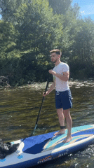 Paddleboarding on a clear river outside Siversky, Russia