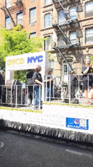 Youth parade float with dancers travels through NYC streets