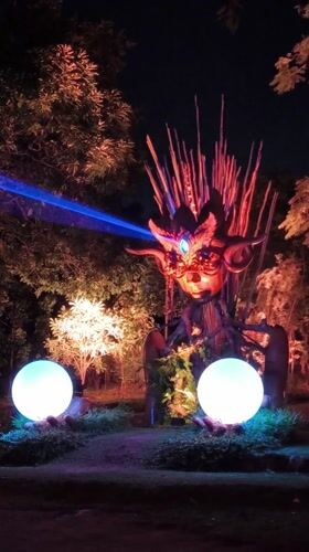 Blue-lit horned statue installation documented at night in Kediri