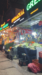 Evening fruit market operates in Anachal, India