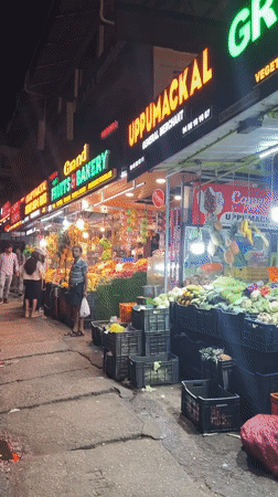 Evening fruit market operates in Anachal, India