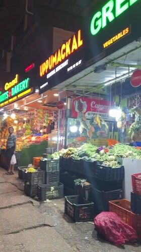 Evening fruit market operates in Anachal, India
