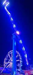 Evening carnival operates in Riga with illuminated rides, games