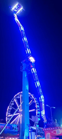 Evening carnival operates in Riga with illuminated rides, games