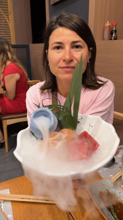 Family enjoys sushi dinner at robot-served Barcelona restaurant