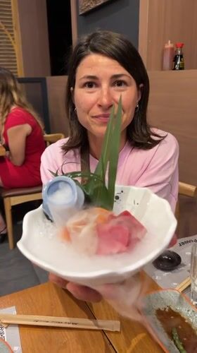 Family enjoys sushi dinner at robot-served Barcelona restaurant