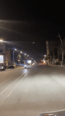 Night drive through Safi shows illuminated clock tower roundabout