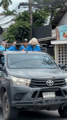 Toyota Hilux with cage bed carries passengers through Ko Samui streets