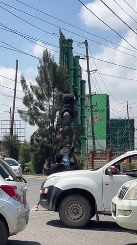 Street performers stage acrobatics on pickup truck in Nairobi