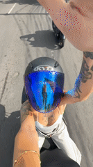 Three riders share motorcycle through Indonesian streets at night