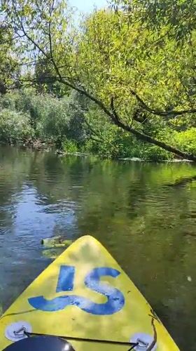 Kayaking a lily pad-covered river in rural Russia