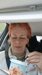Woman in vehicle, branded image captured in Moscow
