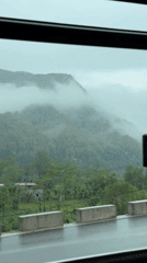 Morning fog blankets mountains viewed from vehicle near Pokhara