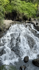 Waterfall documented cascading over rocks in Gianyar, Indonesia