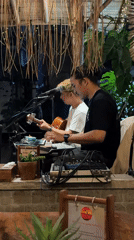 Live acoustic set under a thatched roof in Ubud