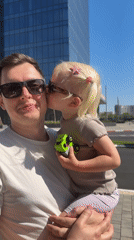 Father and toddler participate in #KissChallenge at Petah Tikva cafe