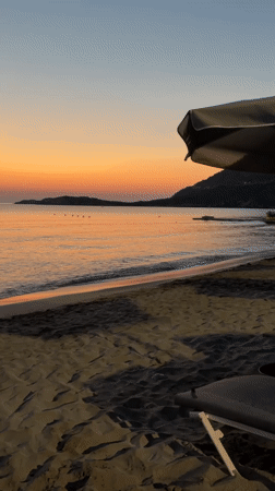 Dusk settles over a quiet beach in Vlichada, Greece