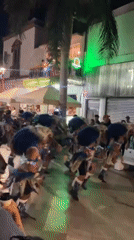 Traditional costume dancers perform nighttime street festival in Arica, Chile