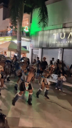 Traditional costume dancers perform nighttime street festival in Arica, Chile