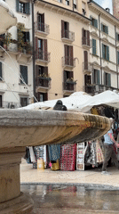 Tourist documents morning stroll through historic Verona city center