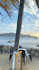 Fishing boat partially submerged at Juan Griego harbor, Venezuela