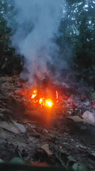 Open trash fire burns through debris in Lhokseumawe