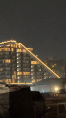 Nighttime commercial district activity documented in Accra