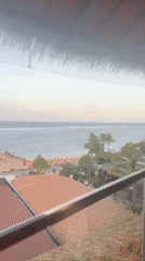 Tourist captures ocean restaurant views and mall interior in Denpasar