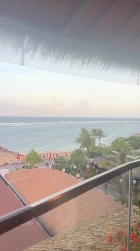 Tourist captures ocean restaurant views and mall interior in Denpasar